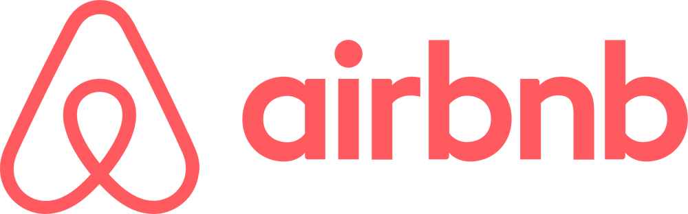 Logotipo de la plataforma de hospedaje Airbnb, con tonos rojos.
